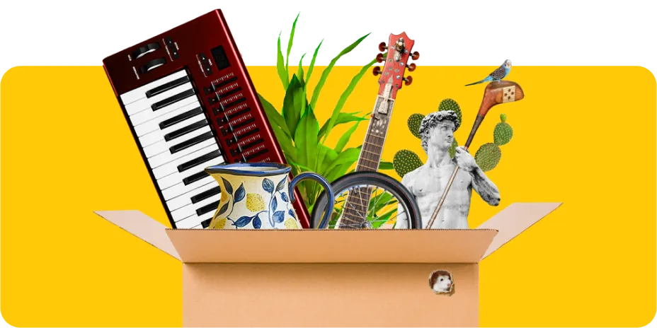 box full of furniture items including keyboard, guitar and vase