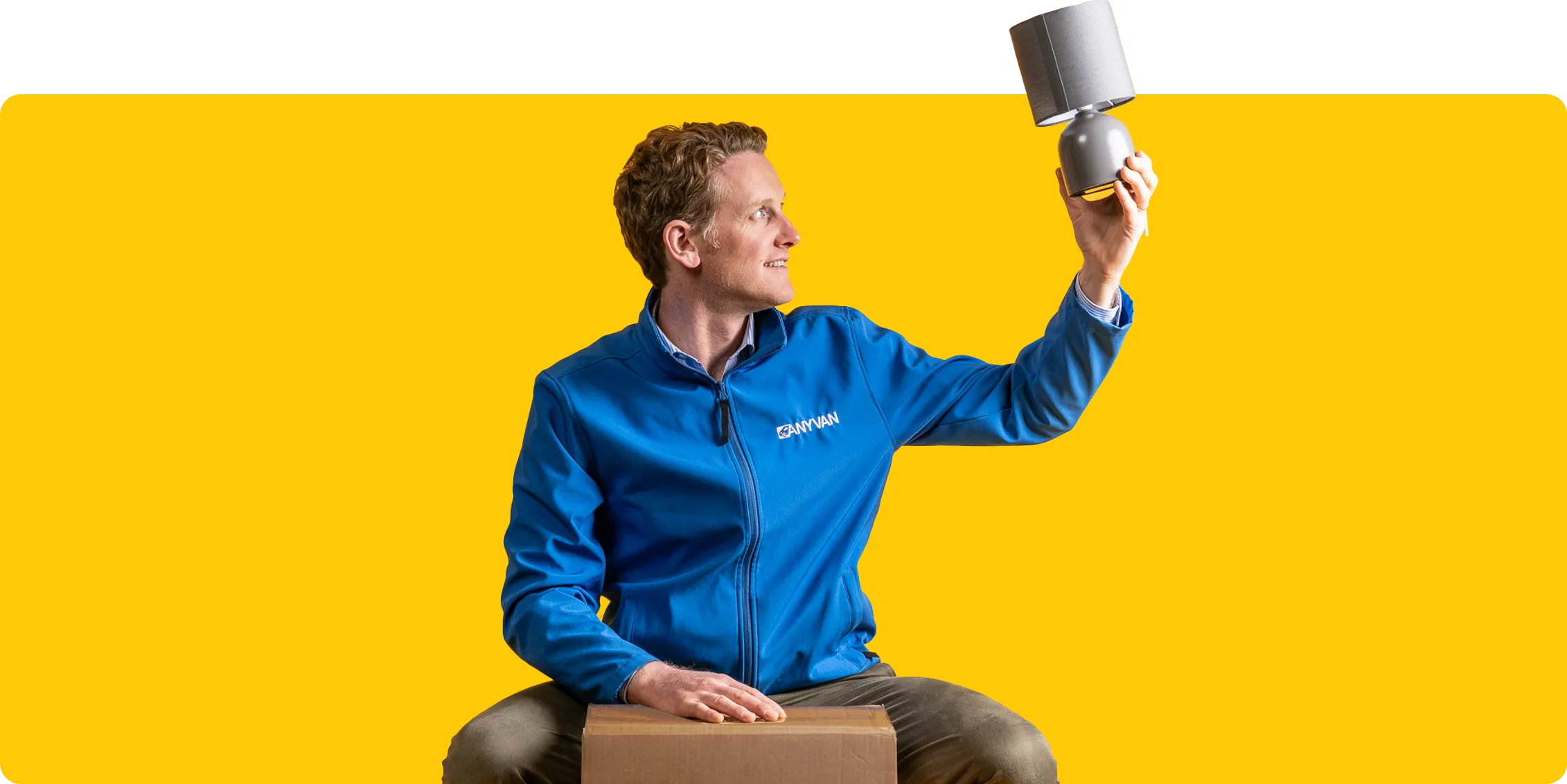 AnyVan founder Angus Elphinstone, holding a lamp 