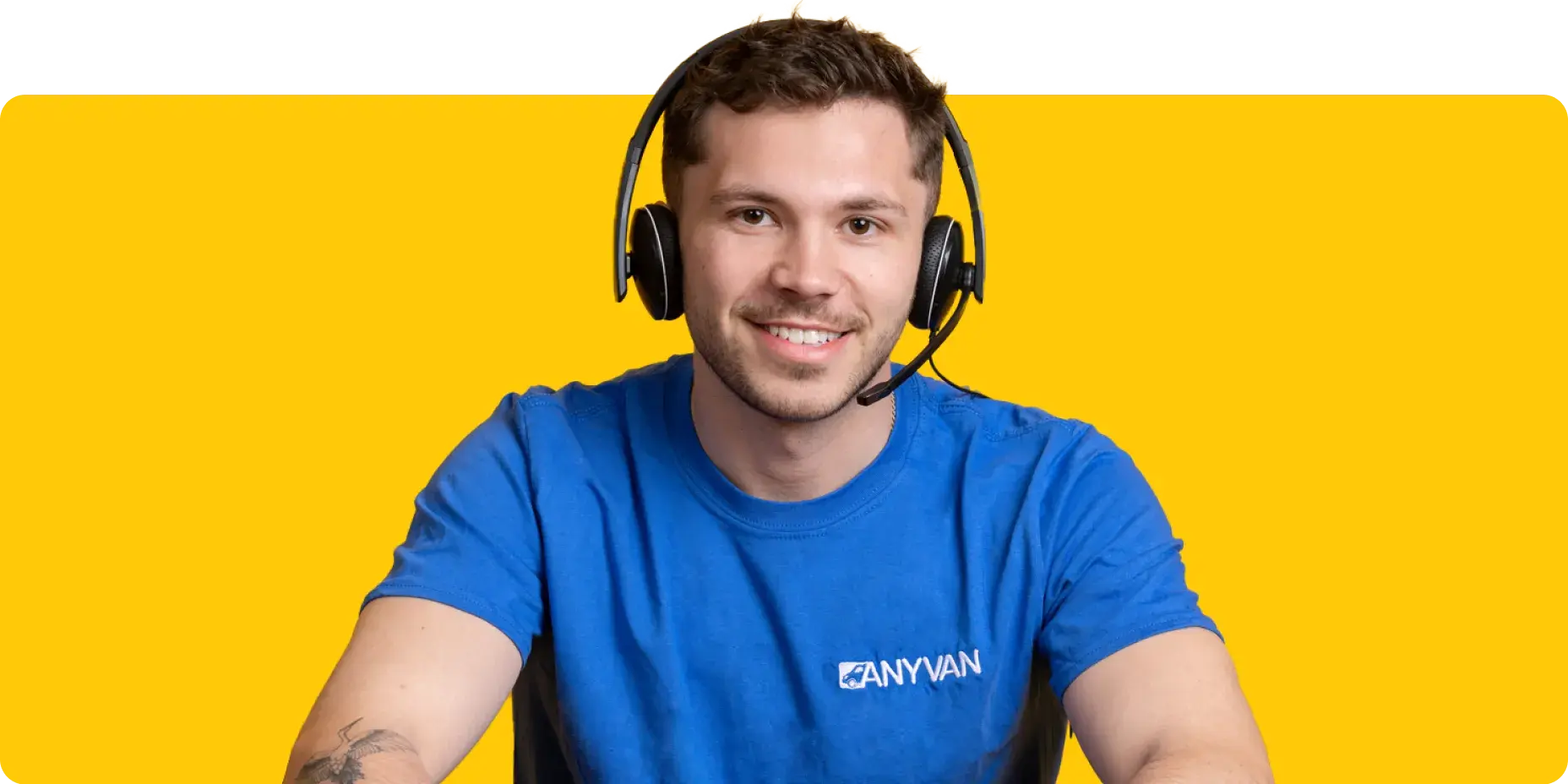 Image of an AnyVan customer service agent with a headset on 