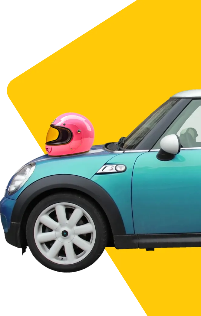 Image of a turquoise mini with a pink helmet on the bonnet 